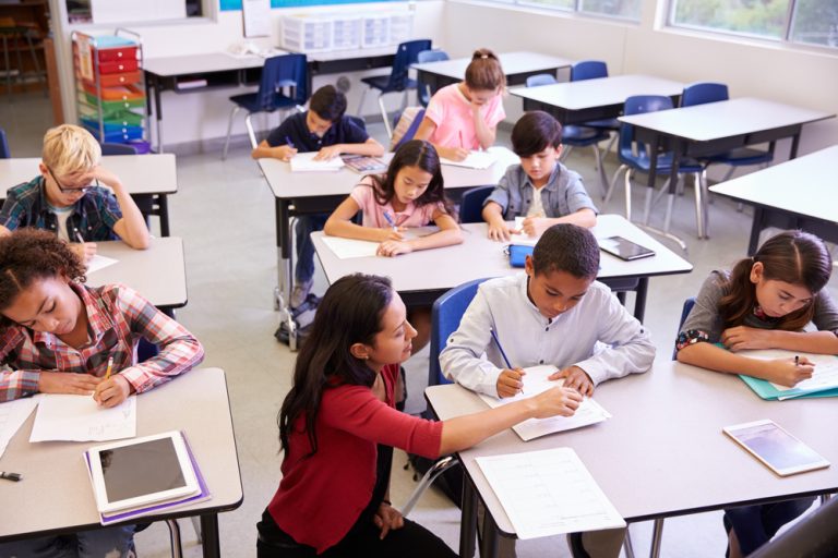 Teacher working with a student