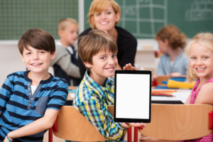 Image of students with an Ipad