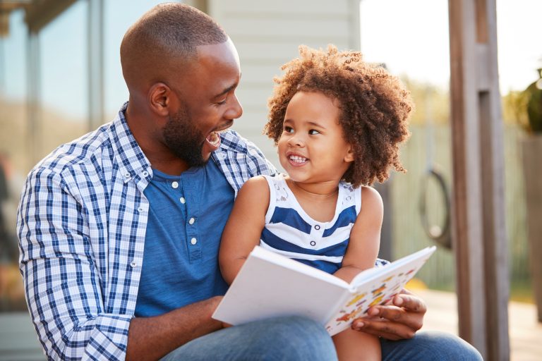 father and daughter reading together