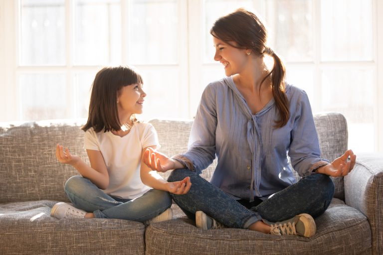 mother and daughter doing mindfulness meditation together