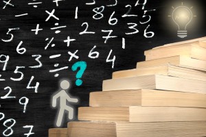 stick man figure climbs staircase made of books with math problems written on a blackboard in the background.