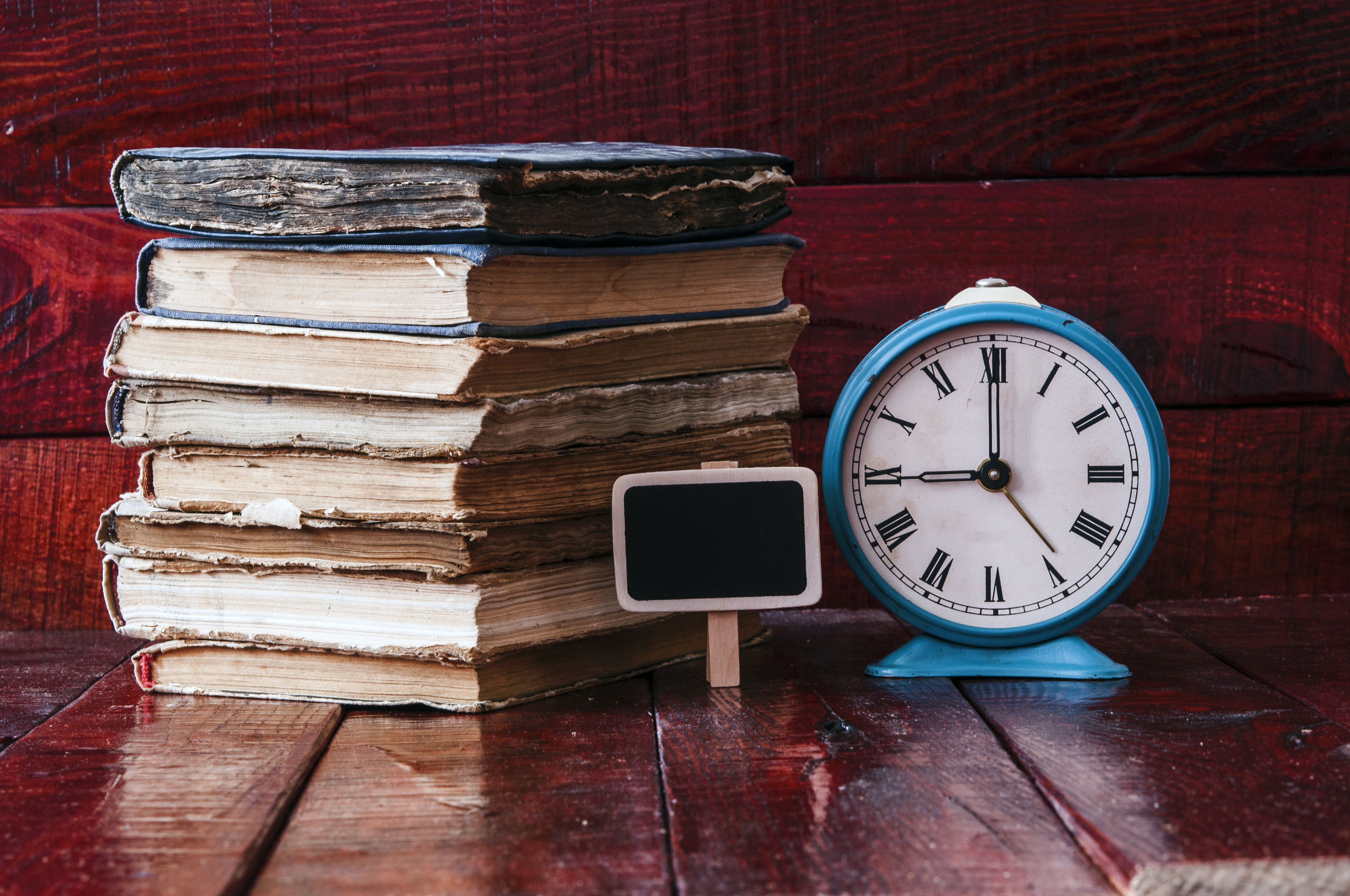 Image of a clock and an old book