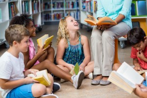 Teacher and students reading in a circle