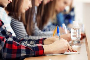 Classroom of students writing