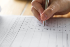 Someone completing a questionnaire