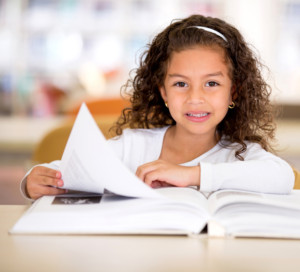 A young girl learning to read