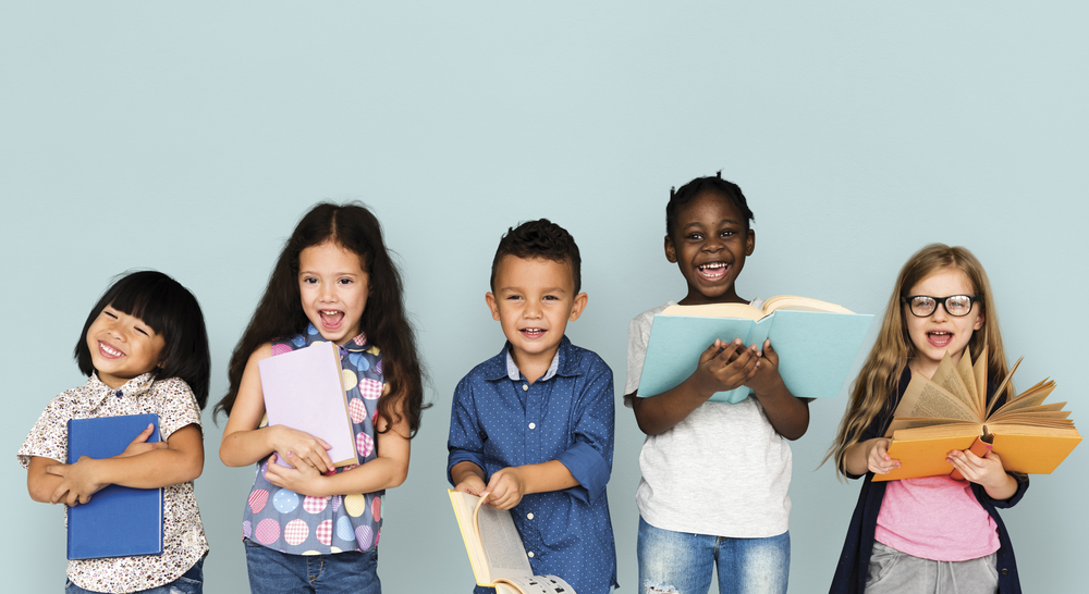 Image of kids reading and laughing