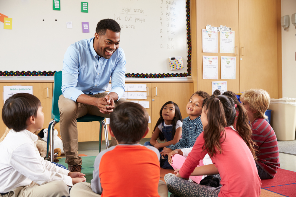 Image of a Teacher and Kids Socializing in Class